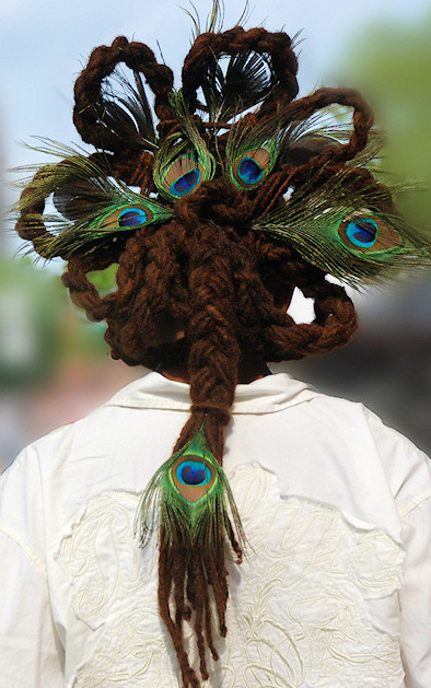 long Dreadlocks styled with peacock feathters