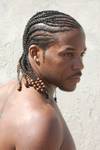 black man with designer cornrows and beads