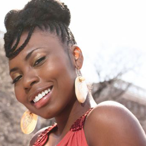 African American woman with natural hairstyle in first style one smiling