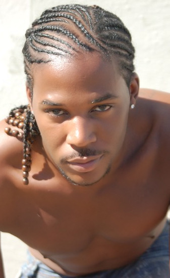 Black man with natural hair in cornrows